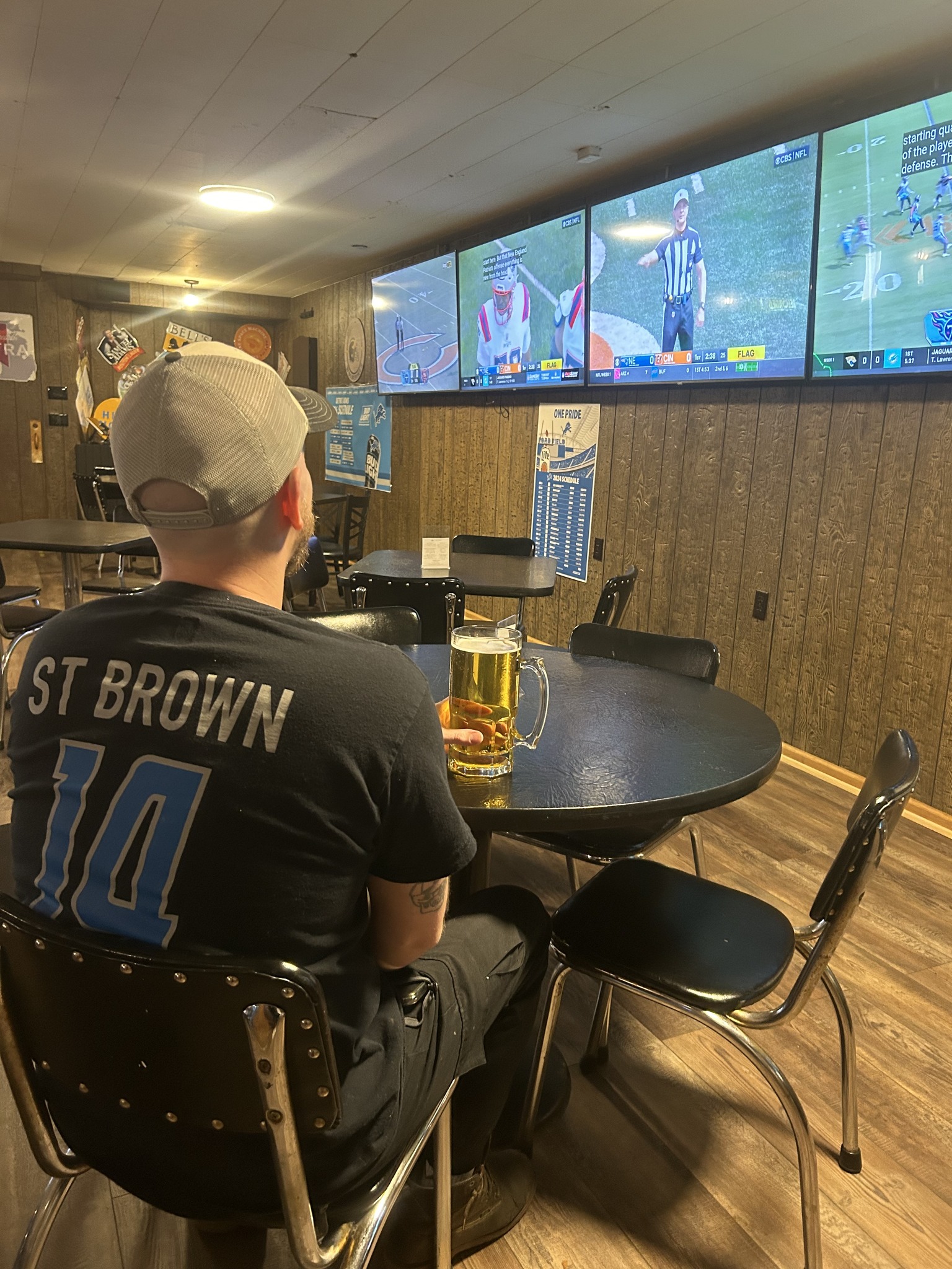 Saranac interior, TVs showing Lions game, neighborhood sports bar